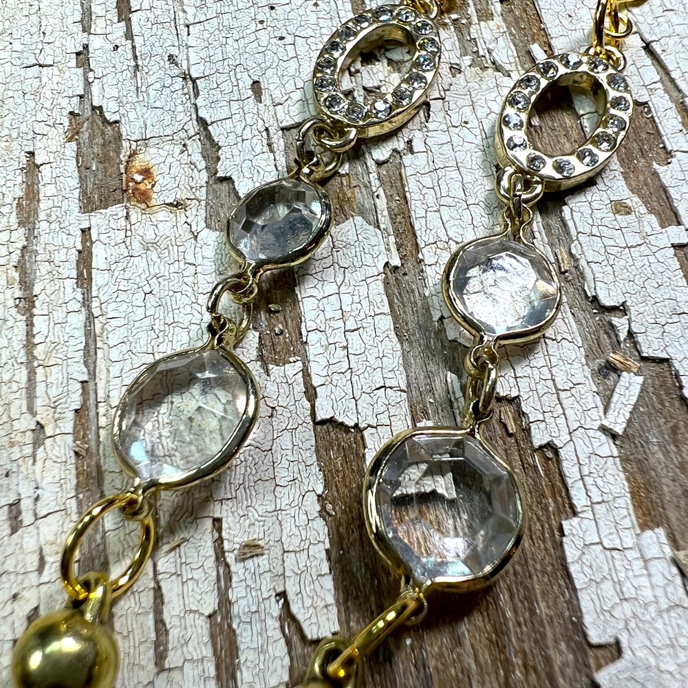 The Quartz Collection:Goldtone pendant w/ faceted quartz bezels by Susan A Ray